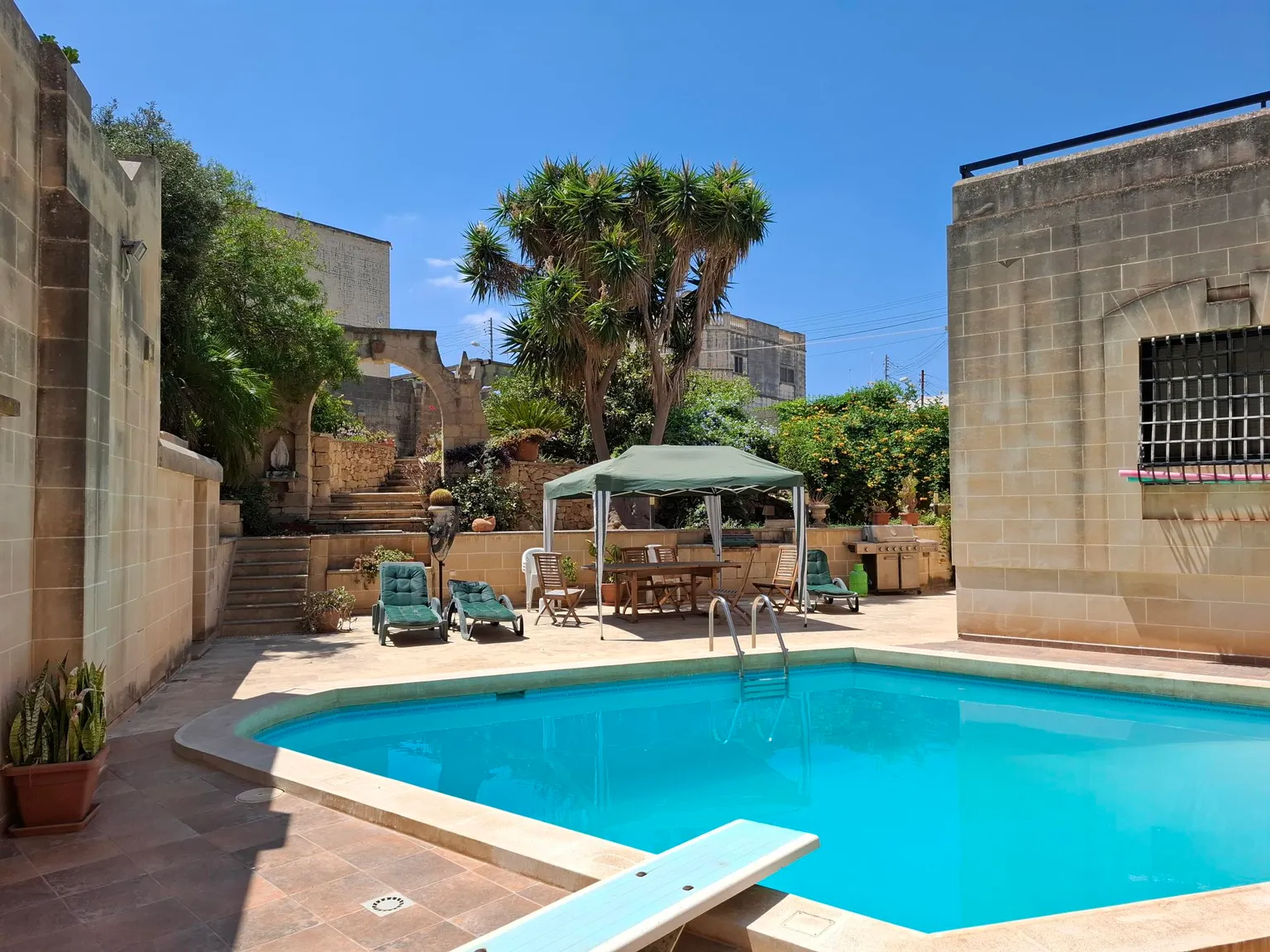 Pool and terrace at the MaltaDesks villa in Il-Gudja